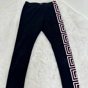 Versace girls’ black leggings featuring the iconic Greca pattern in soft pink